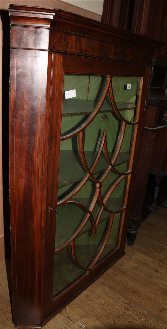 A George III hanging corner cupboard, H.118cm